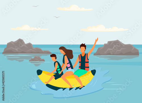 Family is riding banana boat on ocean. People having fun and spending time at beach resort