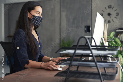 Woman in office during pandemic