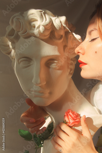 statue and rose and her