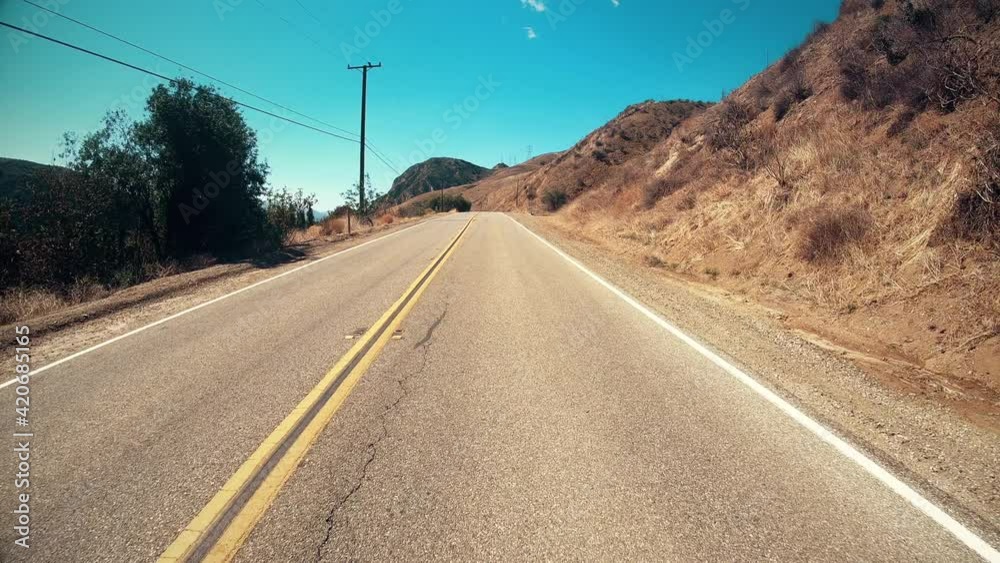 Driving Down A Rural Two Lane Road With One Car Passing By Driving Down A Rural Two Lane Road With One Car Passing By