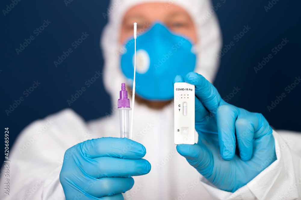 Doctor with laboratory COVID-19 test kit for diagnosis coronavirus infection.