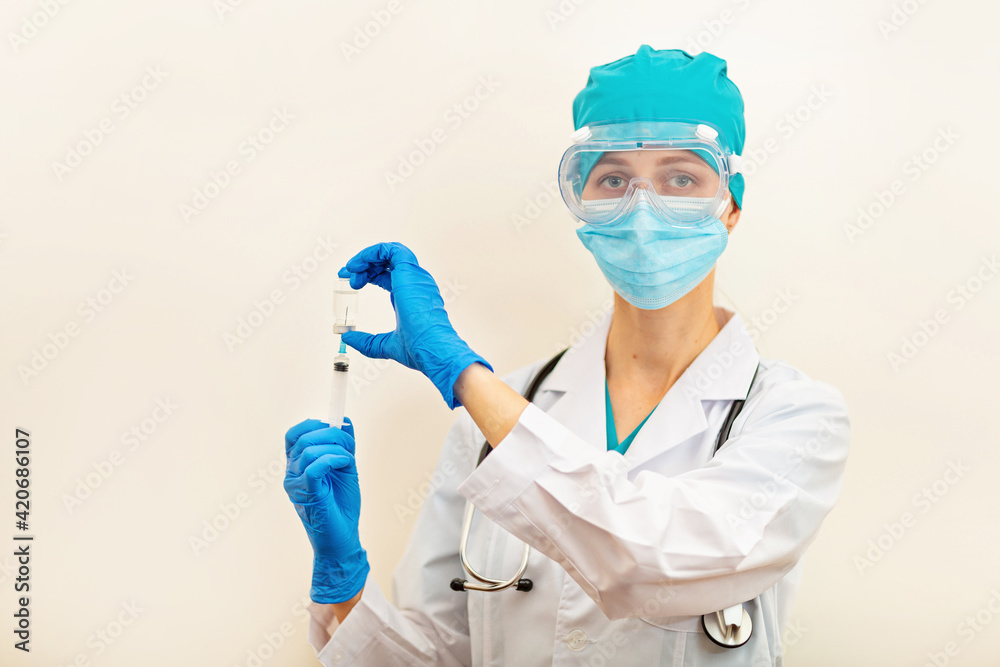 Doctor or nurse holding hands flu vaccine on beige background, measles injection syringe for baby, man, woman vaccination, medicine and drug concept. Vaccination against Coronavirus covid-19 pandemic Doctor or nurse holding hands flu vaccine on beige background, measles injection syringe for baby, man, woman vaccination, medicine and drug concept. Vaccination against Coronavirus covid-19 pandemic