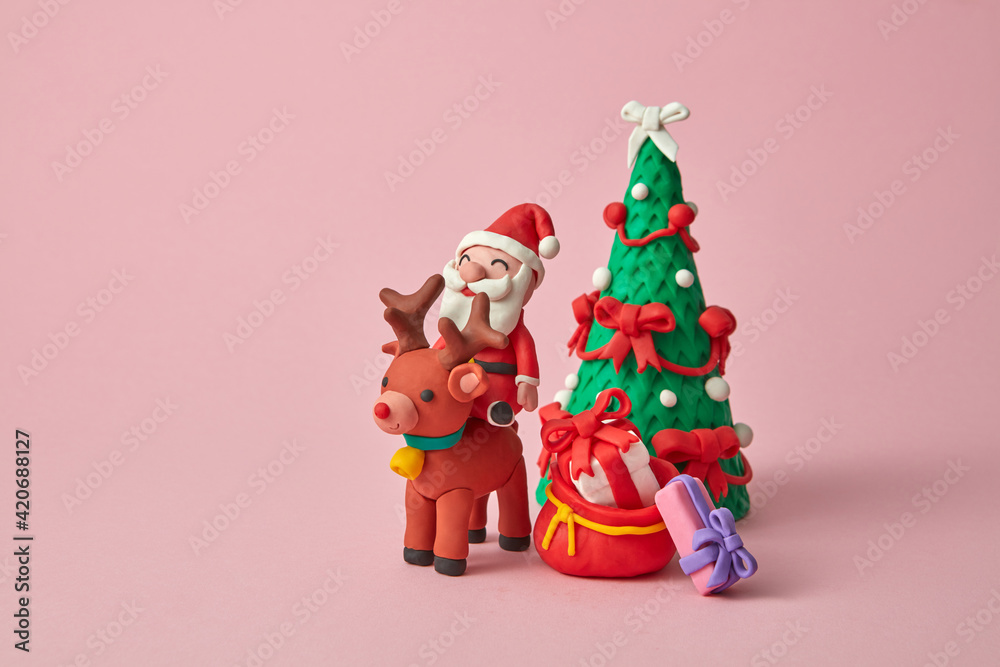 Craft plasticine Santa Claus ride a deer with gifts. Craft plasticine Santa Claus ride a deer with gifts.