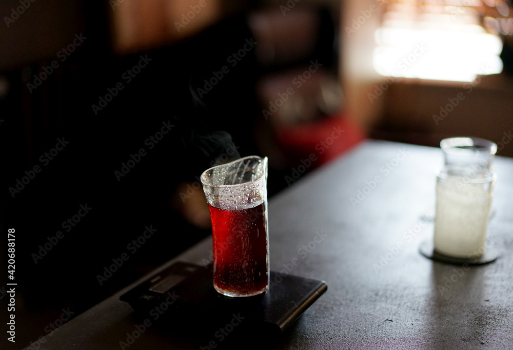 Homemade beautiful coffee glasses on the table, in a dark home atmosphere Homemade beautiful coffee glasses on the table, in a dark home atmosphere