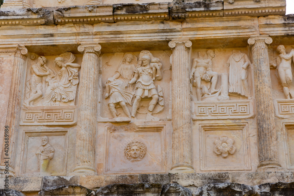 Closeup of figured marble reliefs of antique temple Sebasteion with mythological, allegorical and imperial subjects in ancient city of Aphrodisias, Turkey