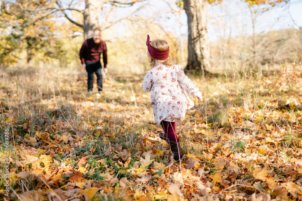 toddler girl running to her father toddler girl running to her father