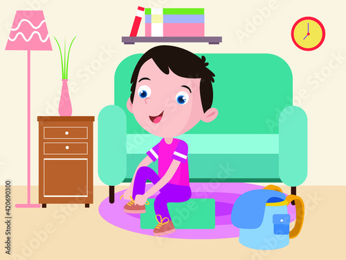Happy cute little kid boy tie shoe shoelace while getting ready to school