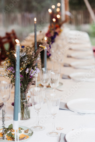 reception indoors with blue candles lit photo