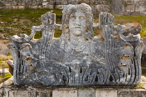 Well preserved Hellenistic architectural ornament acroterion on ruins of Temple of Zeus in Aizanoi, ancient Greek city in western Anatolia, Turkey.. photo