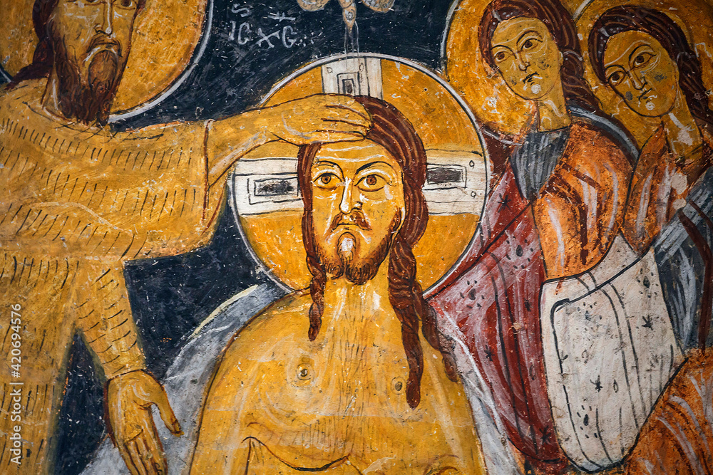 CAPPADOCIA, TURKEY Frescoes on a wall of cave church, Gulsehir - St. Jean Church (Karsi Kilise). Scene Baptism of Jesus Christ