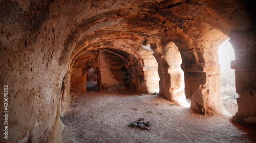 Turkey Achiksaray, suburb of Nevsehir. Ancient ruins of churches carved into sandy rocks. Cappadocia, Turkey