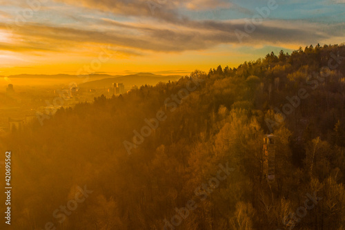 Early morning drone panorama photo of abandoned ski jump tower in Mostec, Ljubljana. Relic of an old ski jumping hill in the Slovenian city.