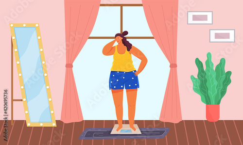 Shamed woman stands on scales and weights. Overweight girl looks at her reflection in mirror
