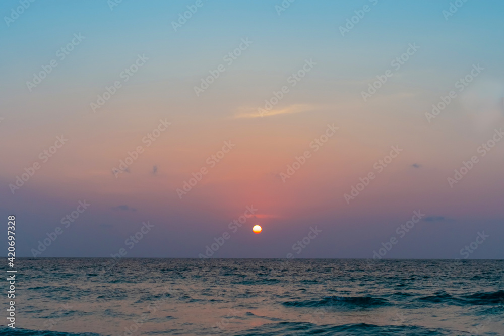 Colorful vibrant ocean sea wave beach summer with sunrise or sunset background landscape on vacation.