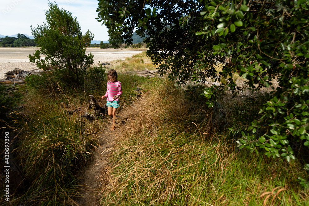 Young girl walking back from the beach. Young girl walking back from the beach.