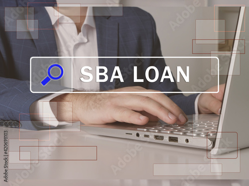 Search SBA LOAN Small Business Administration button. Modern Banker use internet technologies. photo