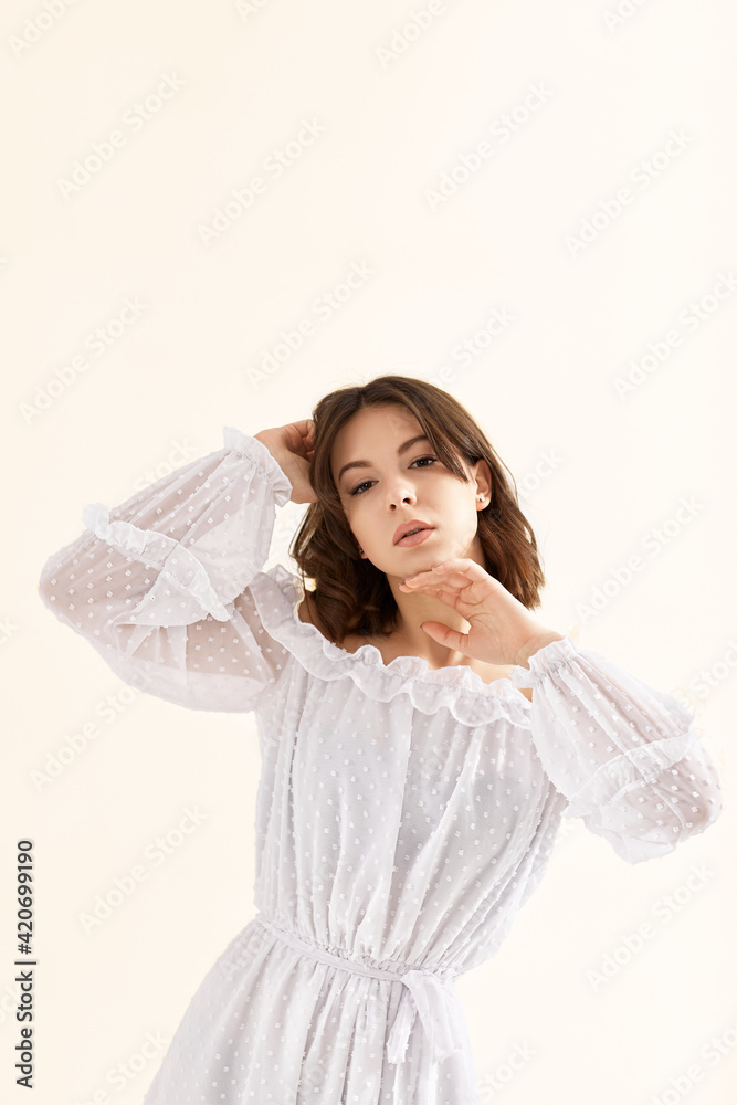 beautiful young brunette woman in white dress beautiful young brunette woman in white dress