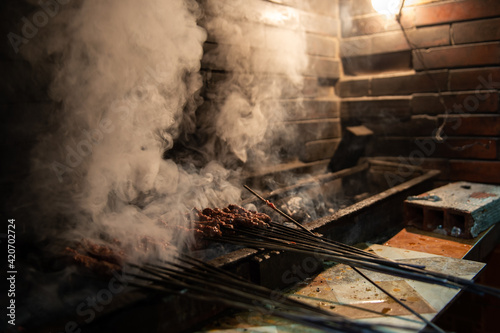 Cooking Shish Kebab in Morocco, smoke rising in the air