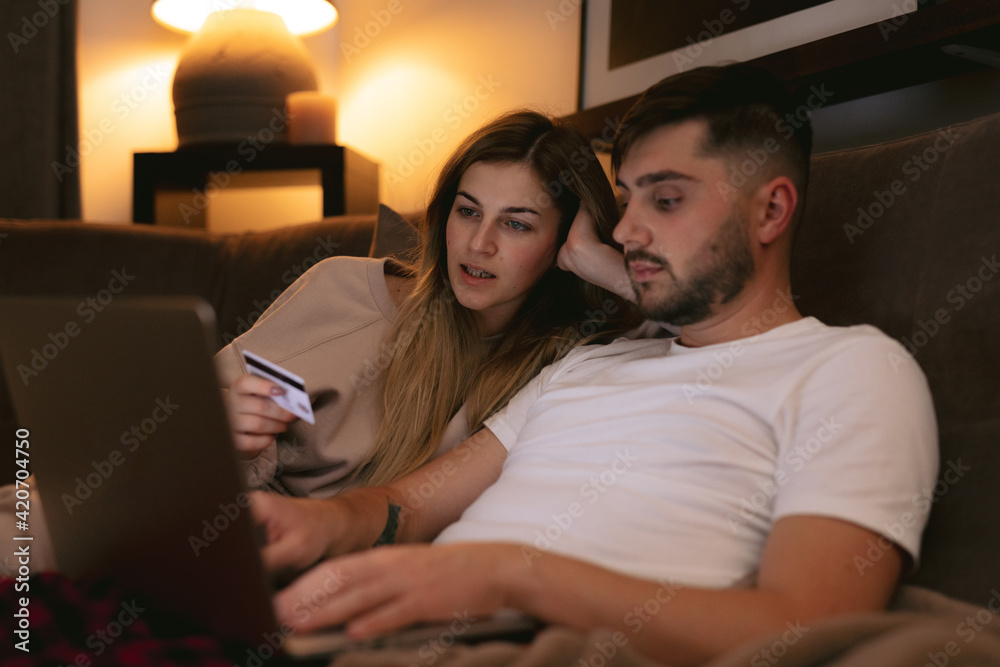 Family choosing and buying Christmas presents online