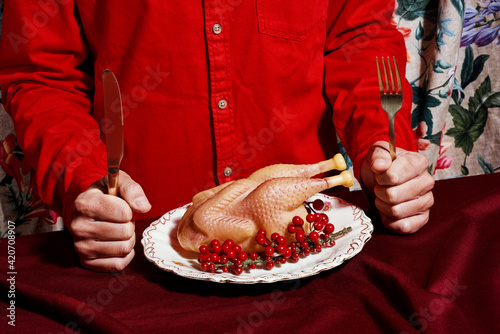 man eating a fake roast turkey photo