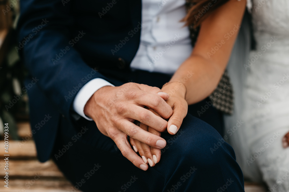 bride and groom holding hands during the ceremony bride and groom holding hands during the ceremony