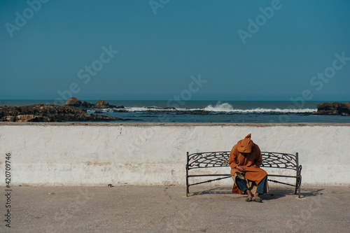 Morocco. stranger resting in historical part of the town photo