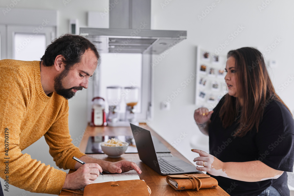 Young couple working from home