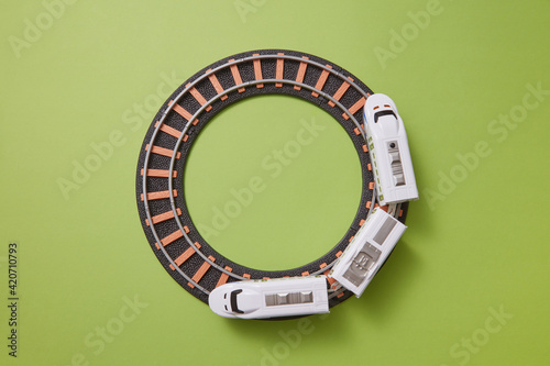 Round railway with plastic train toy.