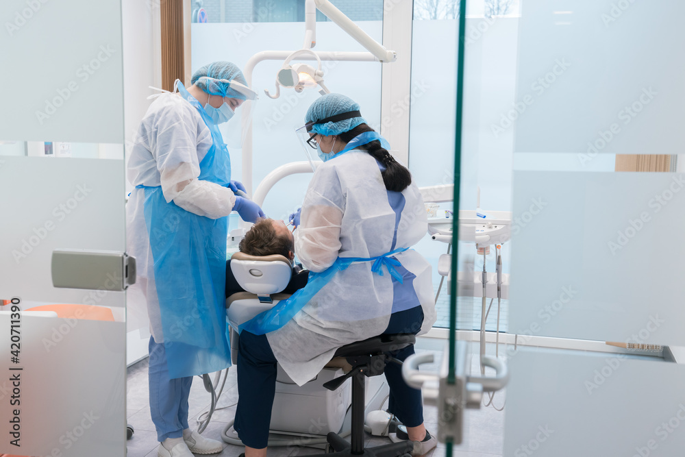 Dental Intervention With Protective Clothes Dental Intervention With Protective Clothes