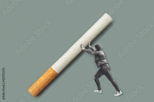 Person holding a bi¡g cigarette