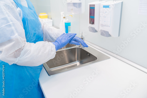 Wallpaper Mural Medical Worker Disinfecting Hands Torontodigital.ca