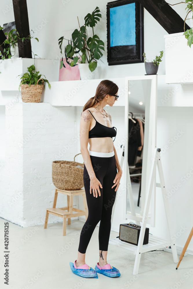 Female client in a tattoo studio. Female client in a tattoo studio.