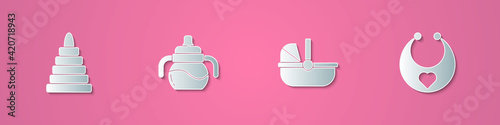 Set paper cut Pyramid toy, Baby bottle, stroller and bib icon. Paper art style. Vector