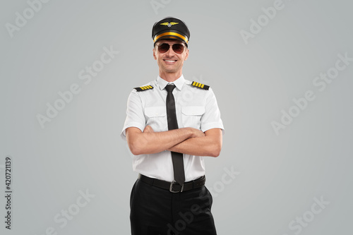 Canvas Confident aviator in uniform with arms crossed