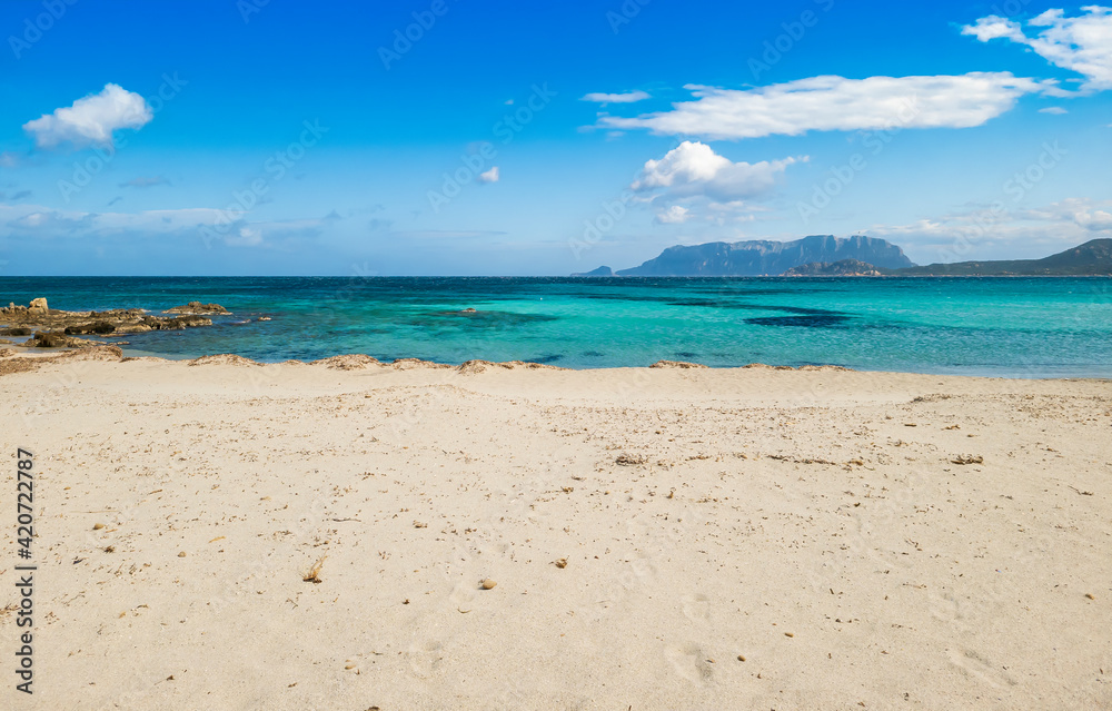 Panoramic view of Pittulongu beach, in the background the island of Tavolara, Olbia - Sardinia Panoramic view of Pittulongu beach, in the background the island of Tavolara, Olbia - Sardinia