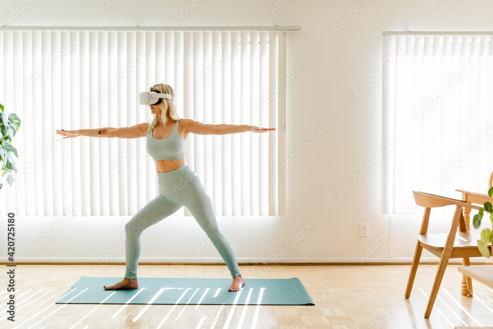 Fit Woman Takes VR Yoga Class Fit Woman Takes VR Yoga Class
