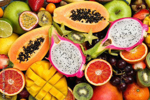 Fototapeta Naklejka Na Ścianę i Meble -  Many different delicious exotic fruits as background, top view