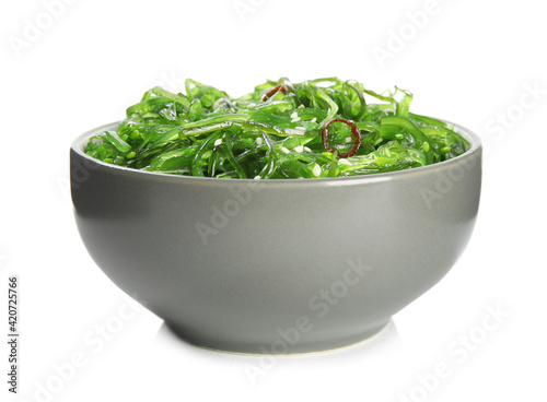 Japanese seaweed salad in bowl isolated on white