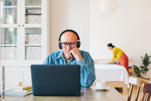 A Man Working on a Computer at Home