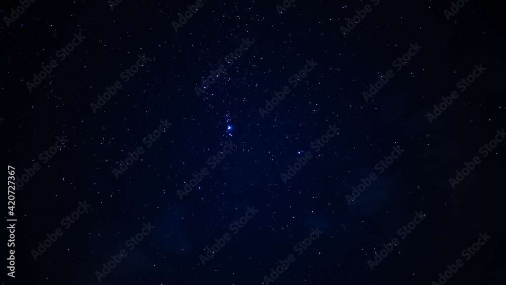 Endless starry sky, over a mysterious landscape 