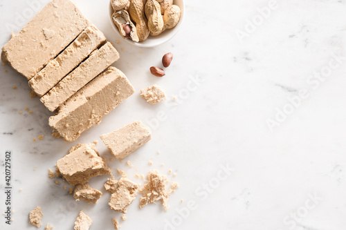 Peanut vegan dessert halva on white background. photo