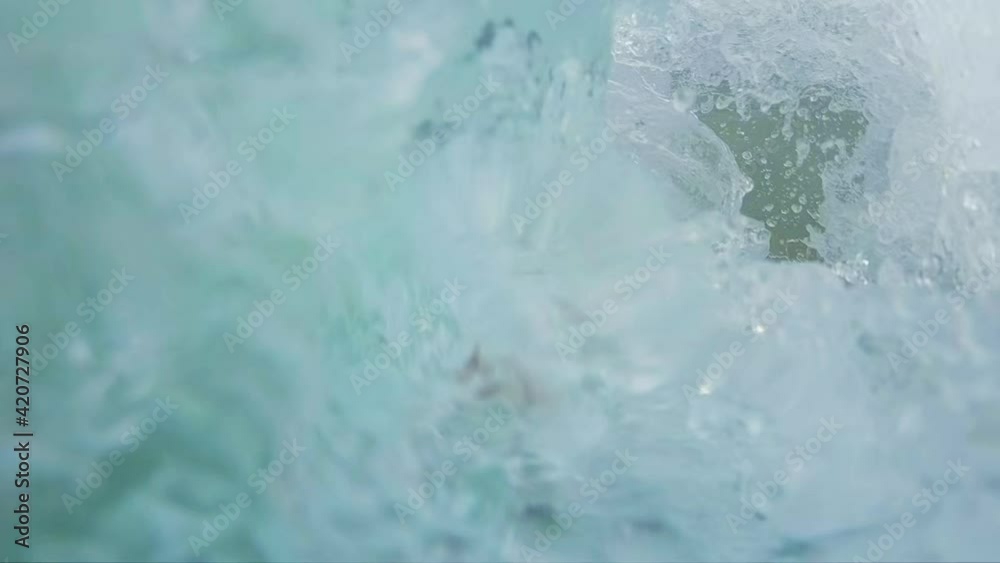Bodysurfing with handboard, handplane. Young man rides the ocean wave by using his body and handboard Bodysurfing with handboard, handplane. Young man rides the ocean wave by using his body and handboard