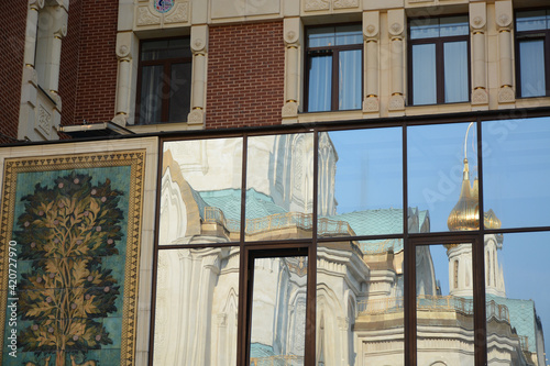 MOSCOW, RUSSIA - 18 OCTOBER, 2018: Reflection view in the window of Sretensky Monastery
