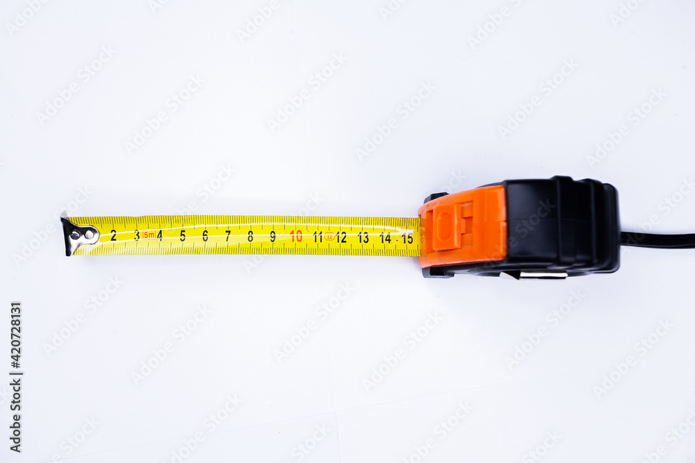Yellow measuring tape isolated cut out on white background, top view Yellow measuring tape isolated cut out on white background, top view
