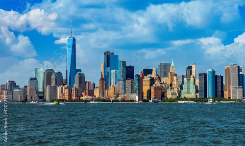 View of Manhattan Skyline, from Liberty State Park in Jersey City, New Jersey. Manhattan is the most densely populated of the five boroughs of New York City. photo