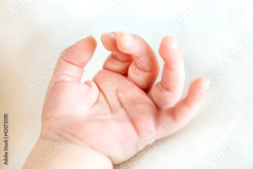 Close up of newborn baby hand