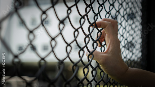 Photography Slavery trade and trafficking victim concept of woman prisoner in jail being tor