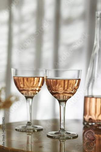 Two Glasses of Rose Wine in Vintage Glasses photo