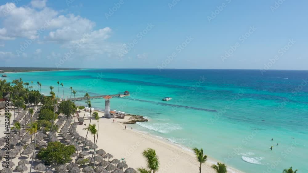 Blue Caribbean coast and wide white sand beach stock video 4k. Summer vacation on the beach of the Dominican Republic. The best beaches in the world video background. Blue Caribbean coast and wide white sand beach stock video 4k. Summer vacation on the beach of the Dominican Republic. The best beaches in the world video background.