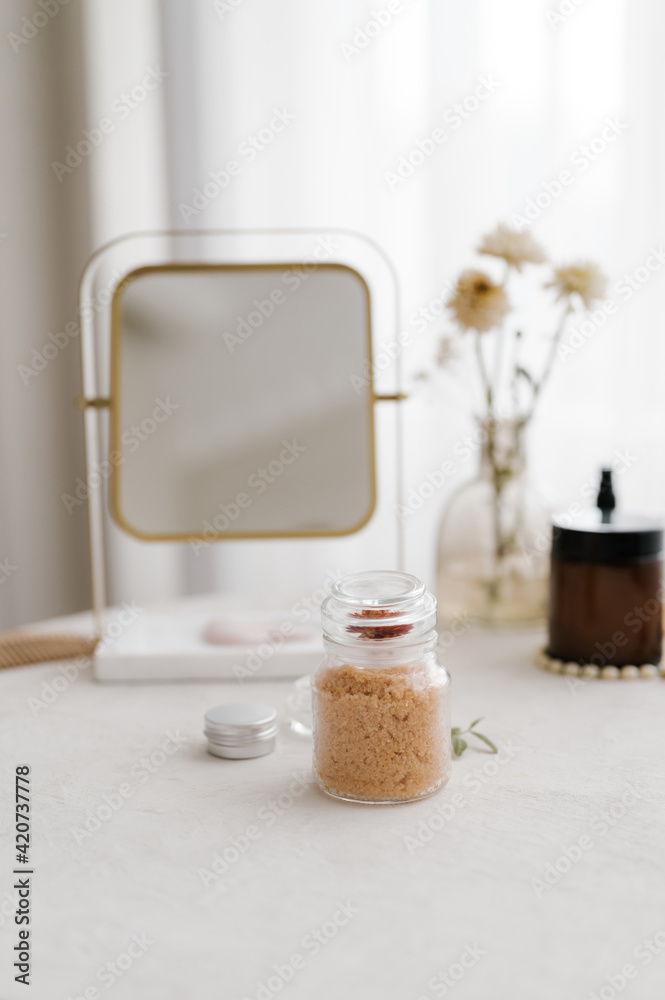 Mirror and cosmetic products on table Mirror and cosmetic products on table